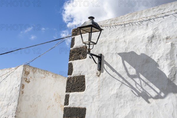Typical white house with alleyway lamp in an alley, Teguise, Lanzarote, Canary Islands, Spain