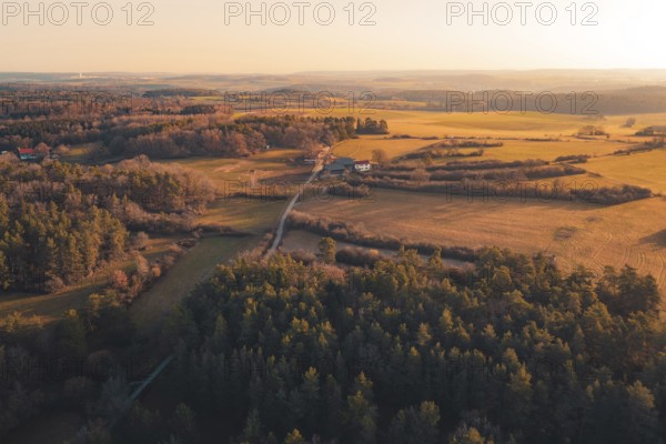 Open landscape with fields and forests at sunset, isolated houses bring seclusion, Gechingen, Calw district, Germany