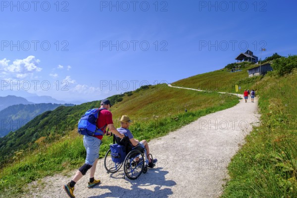 Hikers, wheelchair users, barrier-free access on the mountain, summit, on Hochfelln, mountains, Chiemgau Alps, Chiemgau, Upper Bavaria, Bavaria, Germany