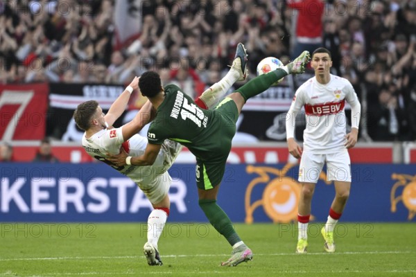 Football ballet, duel, action Moritz Jenz VfL Wolfsburg (15) against Ermedin Demirovic VfB Stuttgart (09) behind Bilal El Khannouss VfB Stuttgart (11) Football Bundesliga, MHPArena, MHP Arena Stuttgart, Baden-Württemberg, Germany