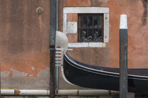 The metal tail of a gondola, the six stripes symbolize the six districts of Venice, Venice, Veneto, Italy