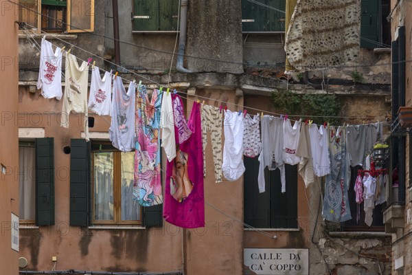 Laundry hung up for tourists in the Castello district, Venice, Veneto, Italy