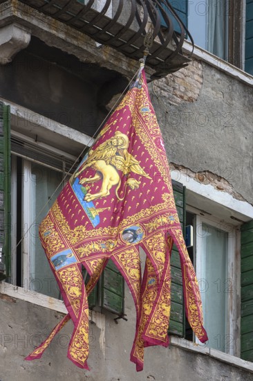 Venetian flag on a balcony, Venice, Veneto, Italy
