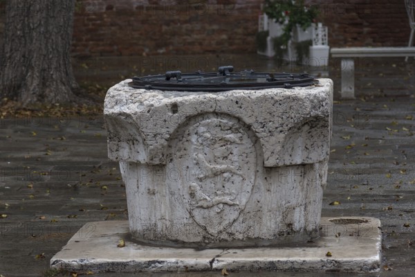 Historic marble fountain with coat of arms, Venice, Veneto, Italy