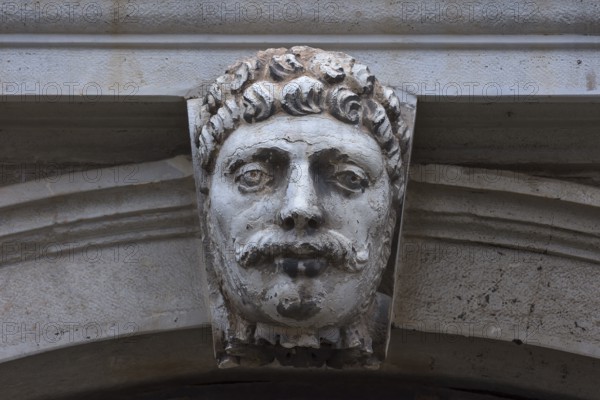 Sculpture of a head above a gate, Venice, Veneto, Italy