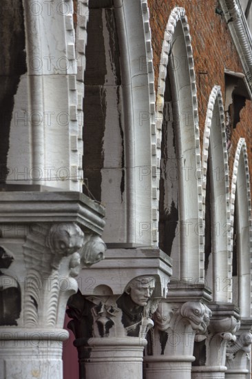 Arcades with figure capitals, from the historic market of Rialto, Venice, Veneto, Italy