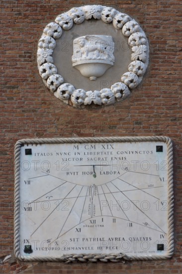 1919 sundial on the right tower to the Arsenal, the Lion of St. Mark at the top, Venice, Veneto, Italy