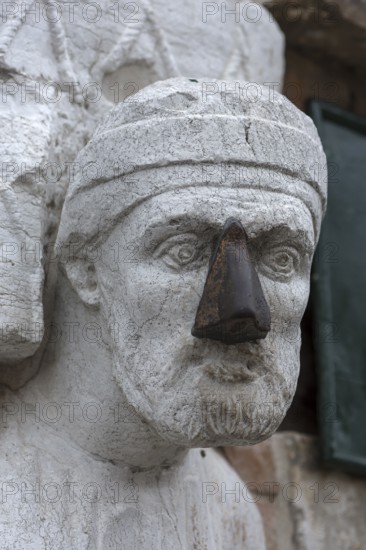 Detail of the marble statue of a merchant family from the 13th and 14th century, Campo dei Mori in the Cannaregio district, Venice, Veneto, in the district of Cannaregio, Venice, Veneto, Italy