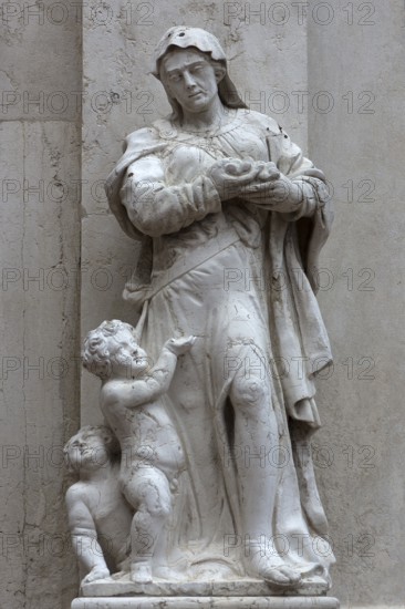 Male sculpture with two small children, Venice, Veneto, Italy