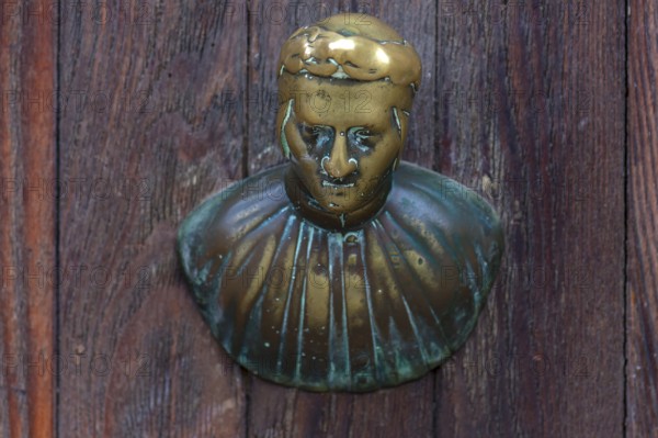 Male bronze figure as doorknob, Venice, Veneto, Italy