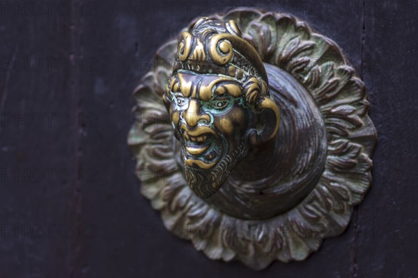 Fantasy male figure as doorknob, Venice, Veneto, Italy