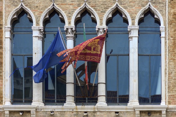 Waving flags of Europe and the Republic of Venice at Palazzo Zaguri, Venice, Venice, Italy