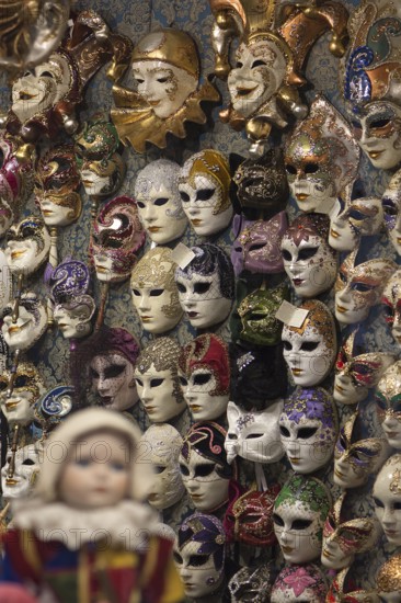 Wall with Venetian carnival masks in a shop, Venice, Veneto, Italy