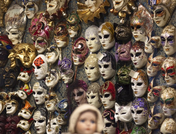 Wall with Venetian carnival masks in a shop, Venice, Veneto, Italy