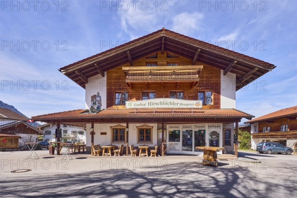 Gasthof und Metzgerei Hirschbichler, commercial building, alpine buildings, building material wood, outdoor area of a restaurant, shade of a tree, milky blue sky, cirrostratus clouds, cirrus clouds, Traunsteiner Straße, Inzell, Traunstein district, Bavaria, Germany