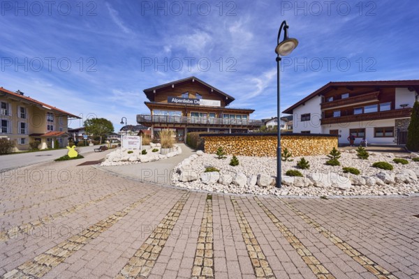 Alpenliebe Design Hotel, Schaufler physiotherapy, general architecture, alpine buildings, commercial buildings, modern architecture, lantern, garden, stone area, street, access path, sidewalk made of concrete paving stones and paving stones, blue sky, cirrus clouds, Fritz-Gastager-Straße junction in Reichenhaller Straße, Inzell, district of Traunstein, Bavaria, Germany