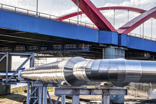 Iqony district heating pipes at the city port, crosses the Rhine-Herne Canal in Essen, A42 motorway bridge, North Rhine-Westphalia, Germany