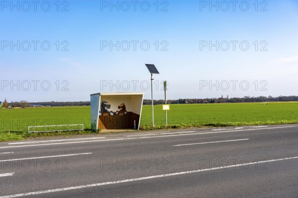 Bus stop in the countryside, Lower Rhine, school bus stop, individually designed, near Alps, North Rhine-Westphalia, Germany