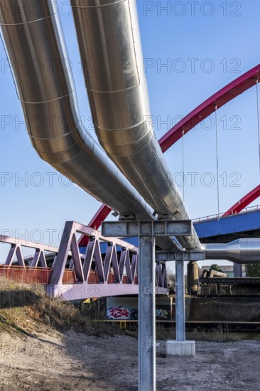 Iqony district heating pipes at the city port, crosses the Rhine-Herne Canal in Essen, A42 motorway bridge, North Rhine-Westphalia, Germany