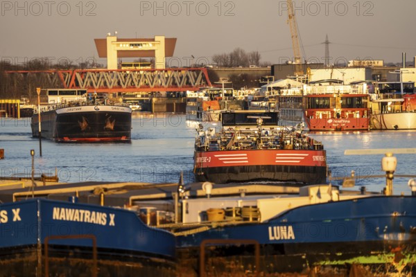 Inland vessels, in the port canal in the port of Ruhrpott, have left the Meiderich canal lock, from the Rhine-Herne Canal and are heading towards the Rhine, tanker Synthese-3 and Christiaan, Duisburg, North Rhine-Westphalia, Germany