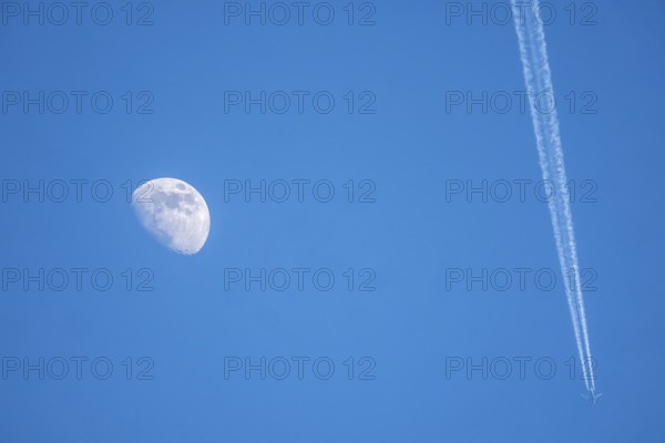 The moon, crescent, increasing, airplane, with contrails