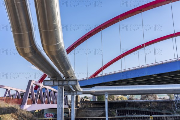 Iqony district heating pipes at the city port, crosses the Rhine-Herne Canal in Essen, A42 motorway bridge, North Rhine-Westphalia, Germany