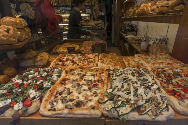 Different pizzas in a window display, Venice, Veneto, Italy