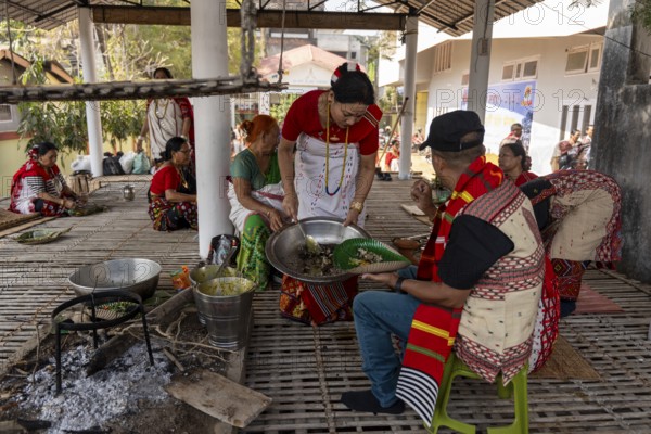 Mising people having traditional food during Ali-Aye-Ligang festival in Guwahati, Assam, India on 18 February 2026. Ali-Aye-Ligang celebrates the Mising community's sowing season with traditional dance, rituals, feasting, and prayers for a prosperous harvest