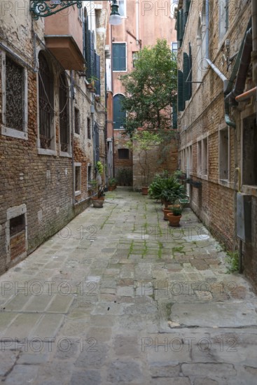 Courtyard between residential buildings in the old town, Venice, Veneto, Italy