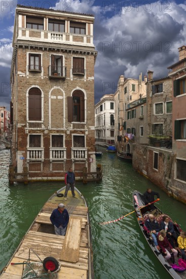 Historic Palazzo Tetta, on the canal, gondola with tourists and workboat, Venice, Veneto, Italy