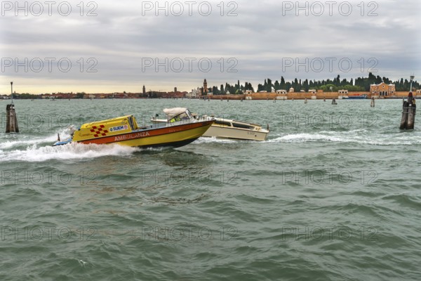 Venetian ambulance in action, San Michele cemetery in the back, Venice, Veneto, Italy