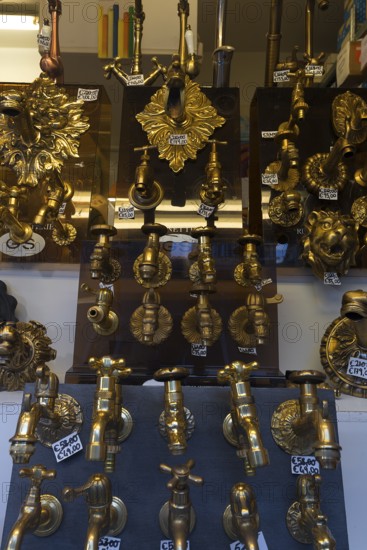 Shop window with gold-colored faucets, Venice, Veneto, Italy
