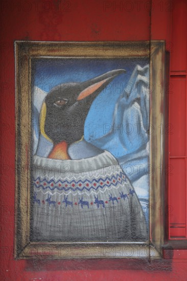 Mural penguin by Guido Zimmermann 2014, street art, graffiti, penguin figure with iceberg and clothing, frame, train station, Dörnigheim, Maintal, Hesse, Germany