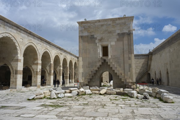 Open courtyard with arched architecture and scattered ancient stones, Sultanhani caravanserai, on the former Silk Road, museum, Sultanhani Kervansaray, Sultanhani, Aksaray province, Turkey
