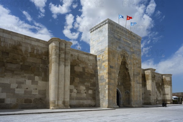 Historic stone architecture with massive gate and towers under a sunny sky, portal of the Sultanhani caravanserai, on the former Silk Road, museum, Sultanhani Kervansaray, Sultanhani, Aksaray province, Turkey