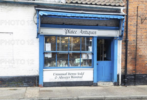 Shop window shopfront of small specialist antique shop, Plaice Antiques, Beccles, Suffolk, England, UK