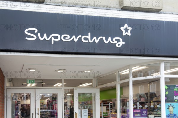 Sign and logo above shop entrance, Superdrug, Beccles, Suffolk, England, UK