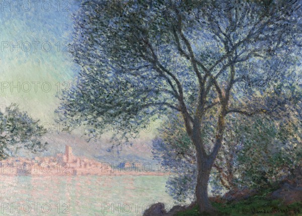 Claude Monet (b. 14 November 1840 in Paris as Oscar-Claude Monet, d. 5 December 1926) important French painter, Impressionist style. Here is his work, Antibes seen from La Salis (1888), Antibes, View from La Salis, A large tree in the foreground with a coastal town in the background, soft light and shadows play through the foliage