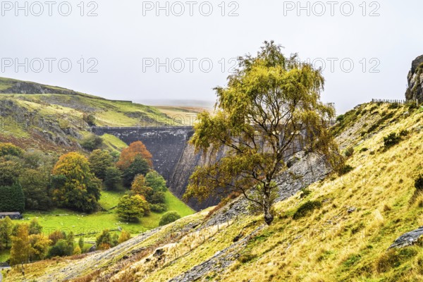 Autumn colors over Claerwen Dam, Claerwen Valley, Elan Valley Reservoir, Rhayader, Powys, Wales, UK