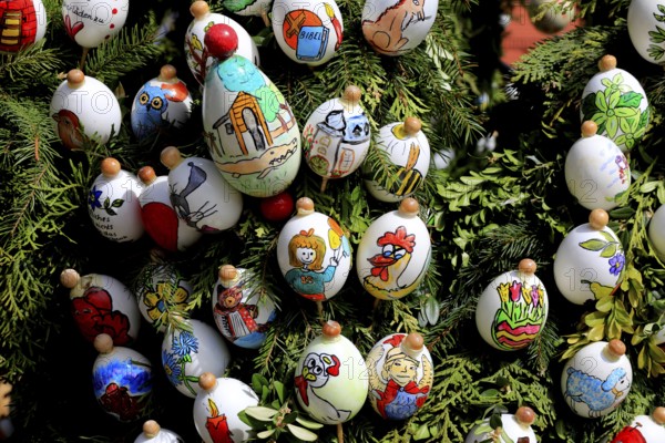 Detail, Easter fountain in Heiligenstadt, Franconian Switzerland, Bamberg district, Upper Franconia, Bavaria, Germany, close-up of artfully painted Easter eggs attached to branches and showing various motifs