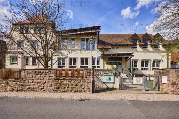 Kindergarten, Kinderwelt Waldaschaff, Catholic Kindergarten St. Michael, commercial building, modern architecture, sandstone wall, wooden fence, metal gate, lantern, bare winter trees, blue sky, cumulus clouds, Untere Forststraße road, Waldaschaff, Lower Franconia, Aschaffenburg district, Bavaria, Germany