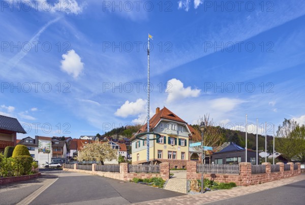 Town hall, maypole, streets, commercial buildings, residential buildings, single-family house, apartment buildings, general development, housing development, hills, coniferous forest, blue sky, cumulus clouds, confluence Hessenthälchenweg in Am Mühlbach, Waldaschaff, Lower Franconia, Aschaffenburg district, Bavaria, Germany