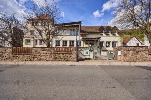 Kindergarten, Kinderwelt Waldaschaff, Catholic Kindergarten St. Michael, commercial building, modern architecture, sandstone wall, wooden fence, bare winter trees, blue sky, cumulus clouds, Untere Forststraße road, Waldaschaff, Lower Franconia, Aschaffenburg district, Bavaria, Germany