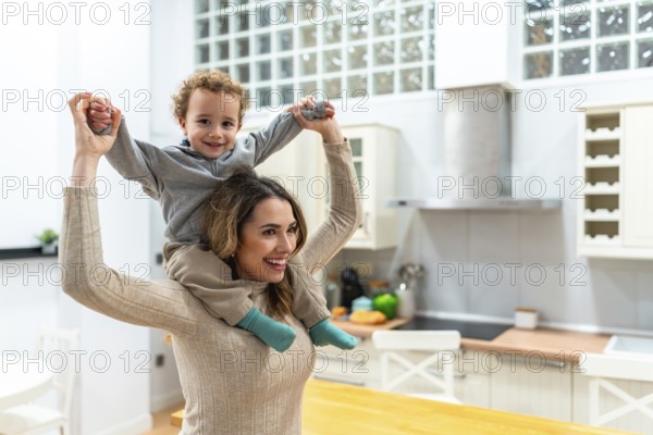 Mother feeling joy and bonding with her playful son during a piggyback ride at home, highlighting happiness, family connection, and daily life together