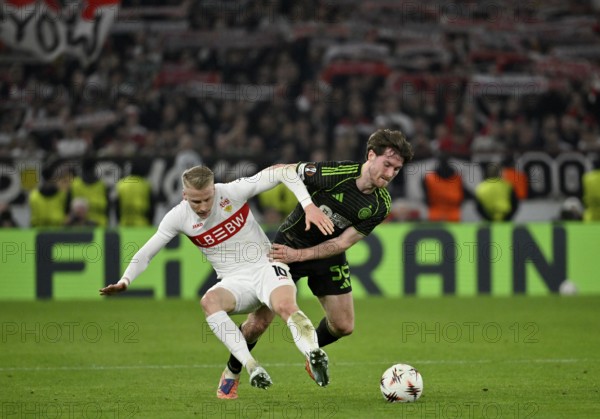 Duel, action Chris Fuehrich VfB Stuttgart (10) against Anthony Ralston Celtic Glasgow FC (56) in the background perimeter advertising logo FLIXTRAIN football UEFA Europa League, MHPArena, MHP Arena Stuttgart, Baden-Württemberg, Germany