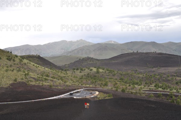 Road snakes through volcanic hills, Craters of the Moon National Monument, Idaho, USA