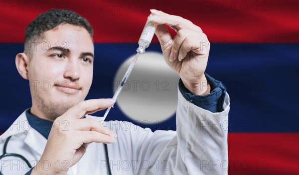 Doctor holding syringe on Laos flag background. Medical professional holding syringe with Laotian flag in the background
