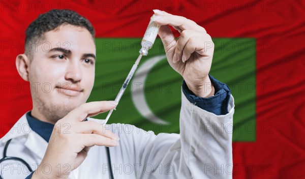 Doctor holding syringe on Maldives flag background. Medical professional holding syringe with Maldivian flag in the background