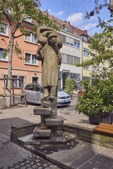 Lauscherbrunnen, stone fountain, sculpture of a person, sculptor Oskar Müller, public art, residential building, parking boxes with car, trees, blue sky, cumulus clouds, Langgasse alleyway, Schenkhof square, Würzburg, Lower Franconia, district-free city, Bavaria, Germany