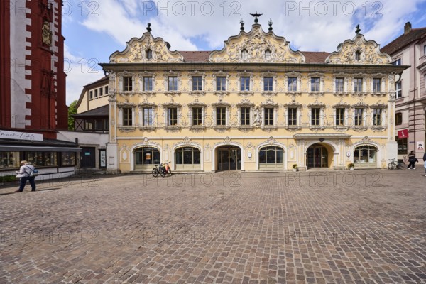 Public library Max-Heim-Bücherei, tourist information, falcon house, historic building, rococo style, façade with windows, stucco decoration and door, gable, cobblestone square, pedestrian as a secondary motif, blue sky, cumulus clouds, market square, Würzburg, Lower Franconia, district-free city, Bavaria, Germany